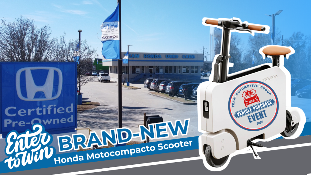 Team Honda Used Cars parking lot with brand-new Honda Motocompacto Scooter